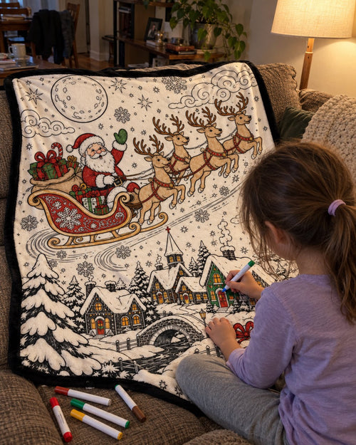 Child coloring the Santa's Sleigh blanket on the couch